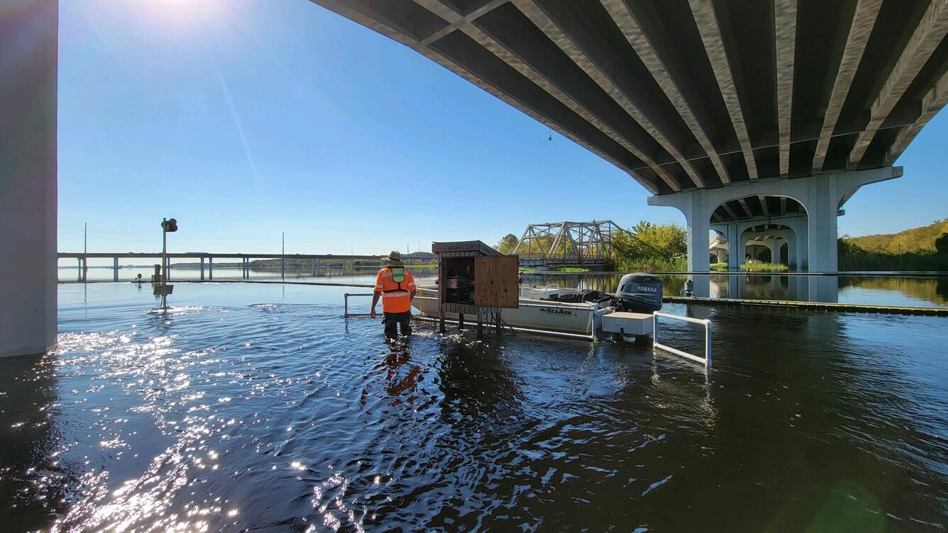 After Hurricane Ian, USGS scientist services the USGS streamgage on the St. Johns River near Sanford, Florida.