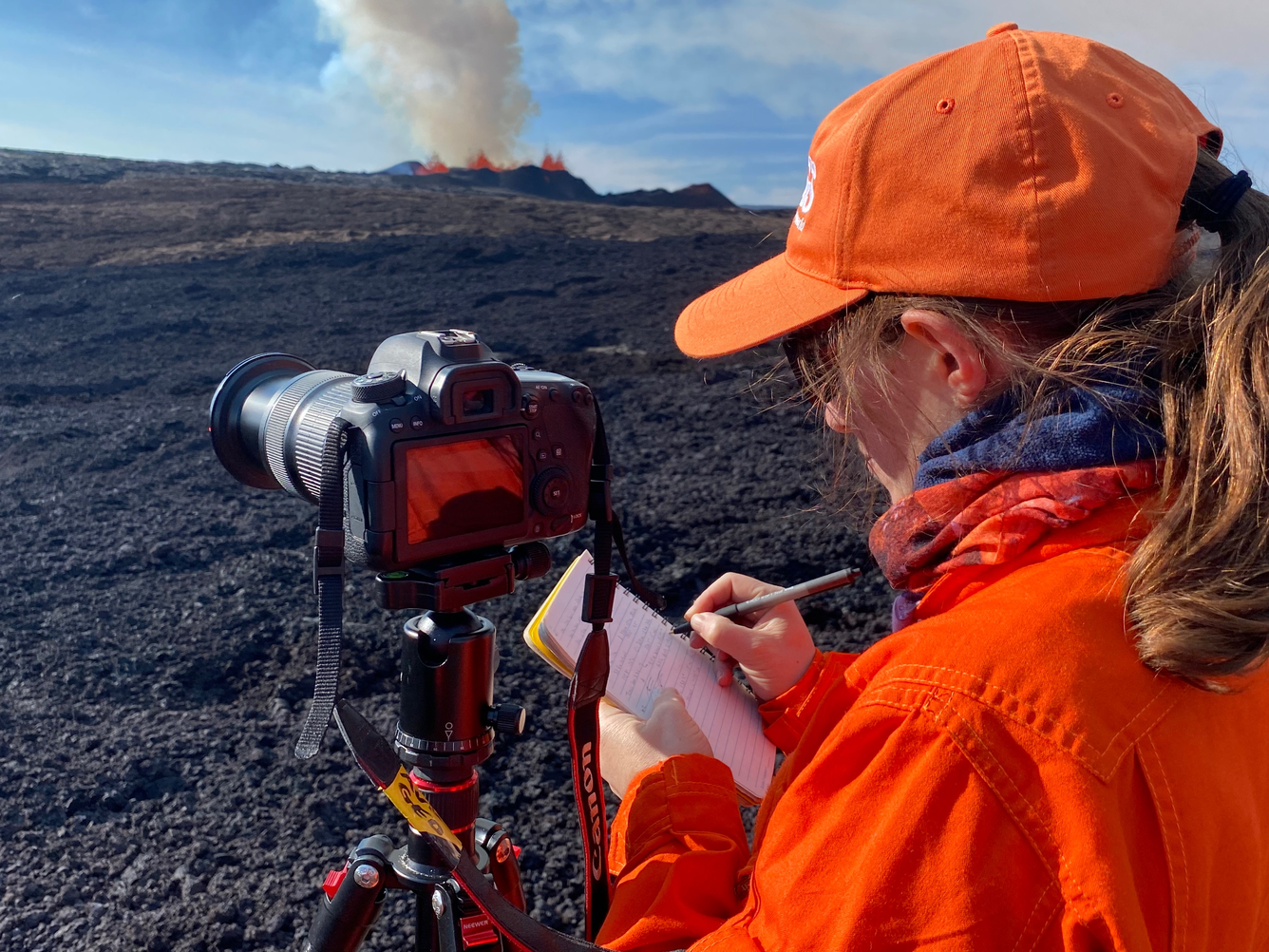 Scientist documenting eruption