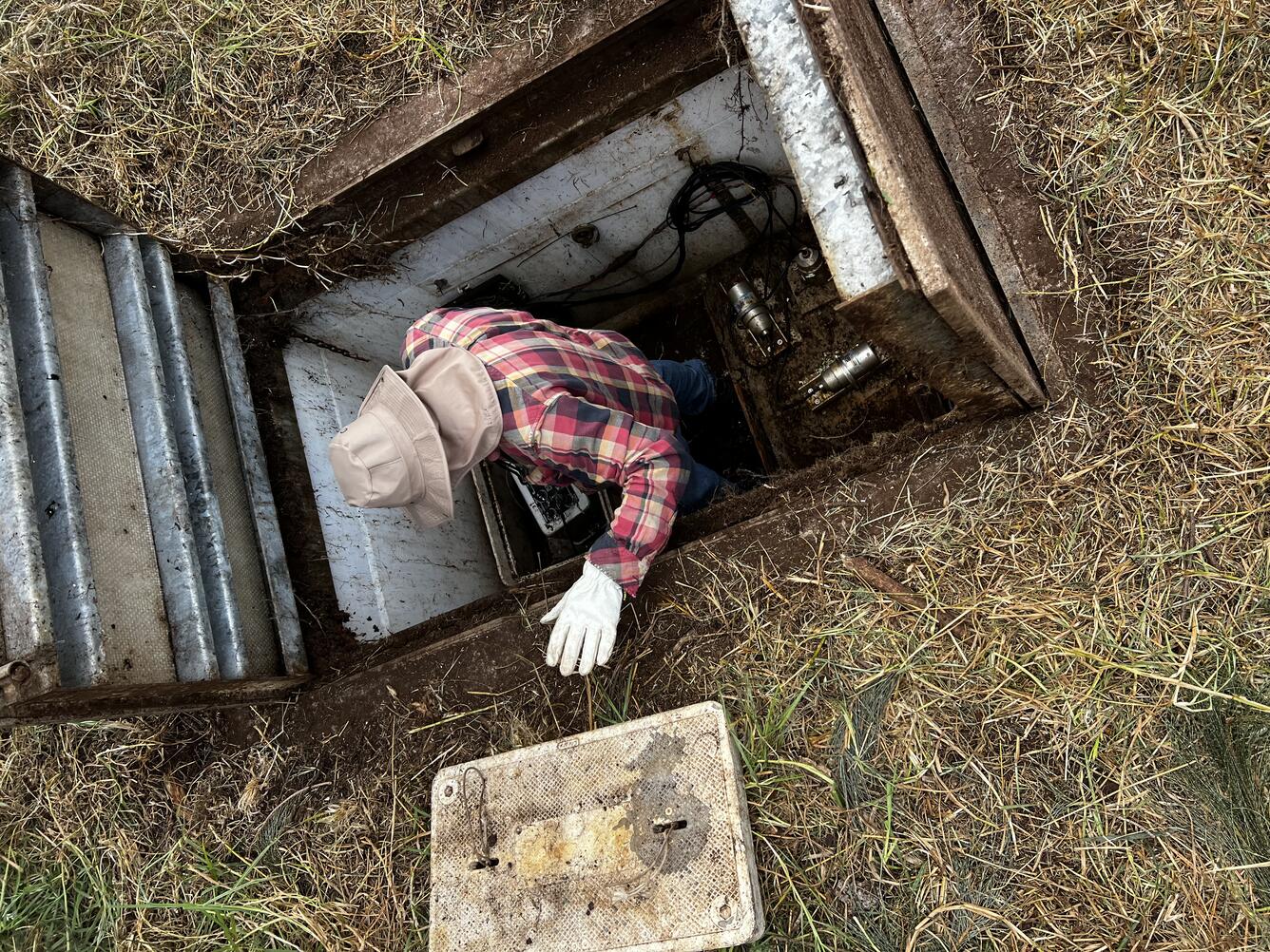 Color photograph of technician in seismic vault