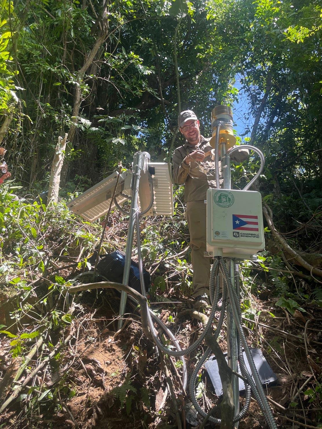 person working on landslide monitoring equipment
