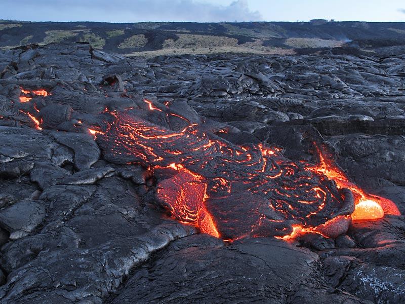 This is a photo of lava oozing from inflating flow 350 m from base of Paliuli.