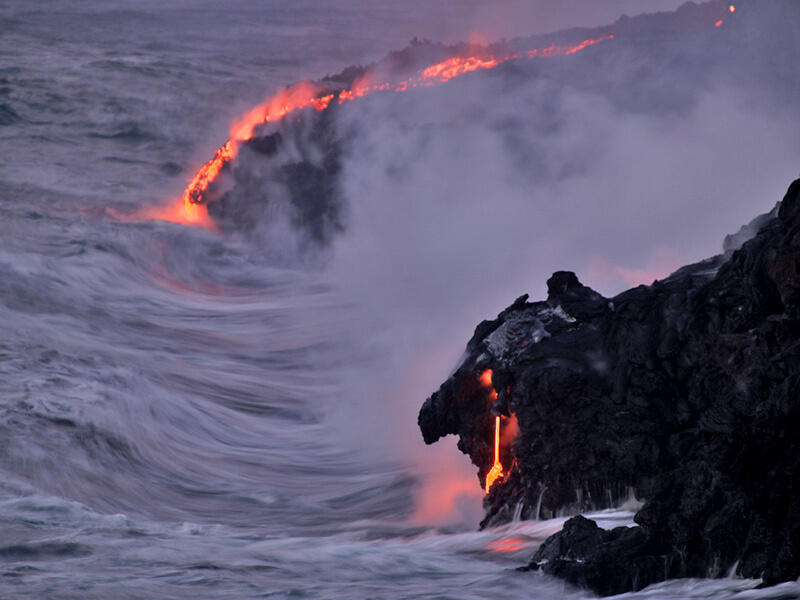 This is a photo of a dawn view of lava entering sea on eastern Banana delta.