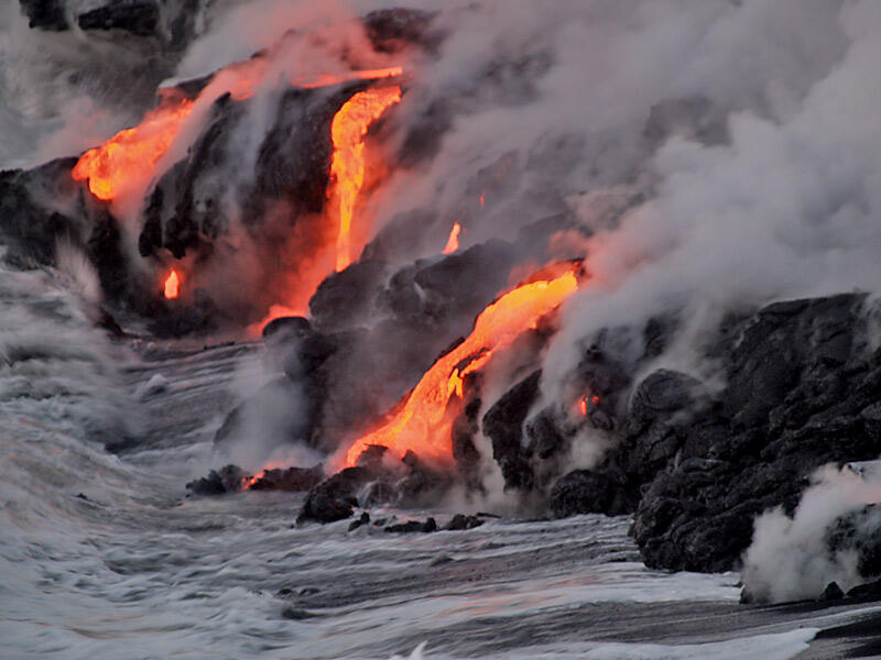This is a photo of lava flowing into water near beach bordering northeastern end of eastern Banana delta.