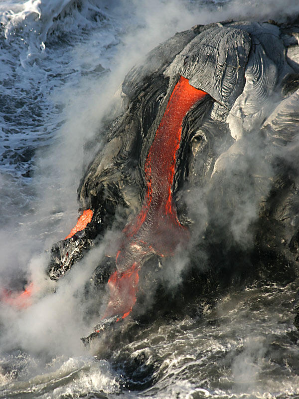 This is a photo of lava pouring into the water off the east side of the East Lae`apuki delta.