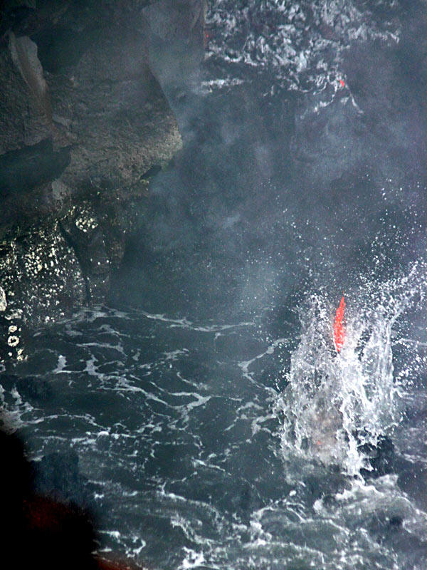 This is a photo of a free-falling orphan blob of lava about to meet its maker, Kamoamoa delta.