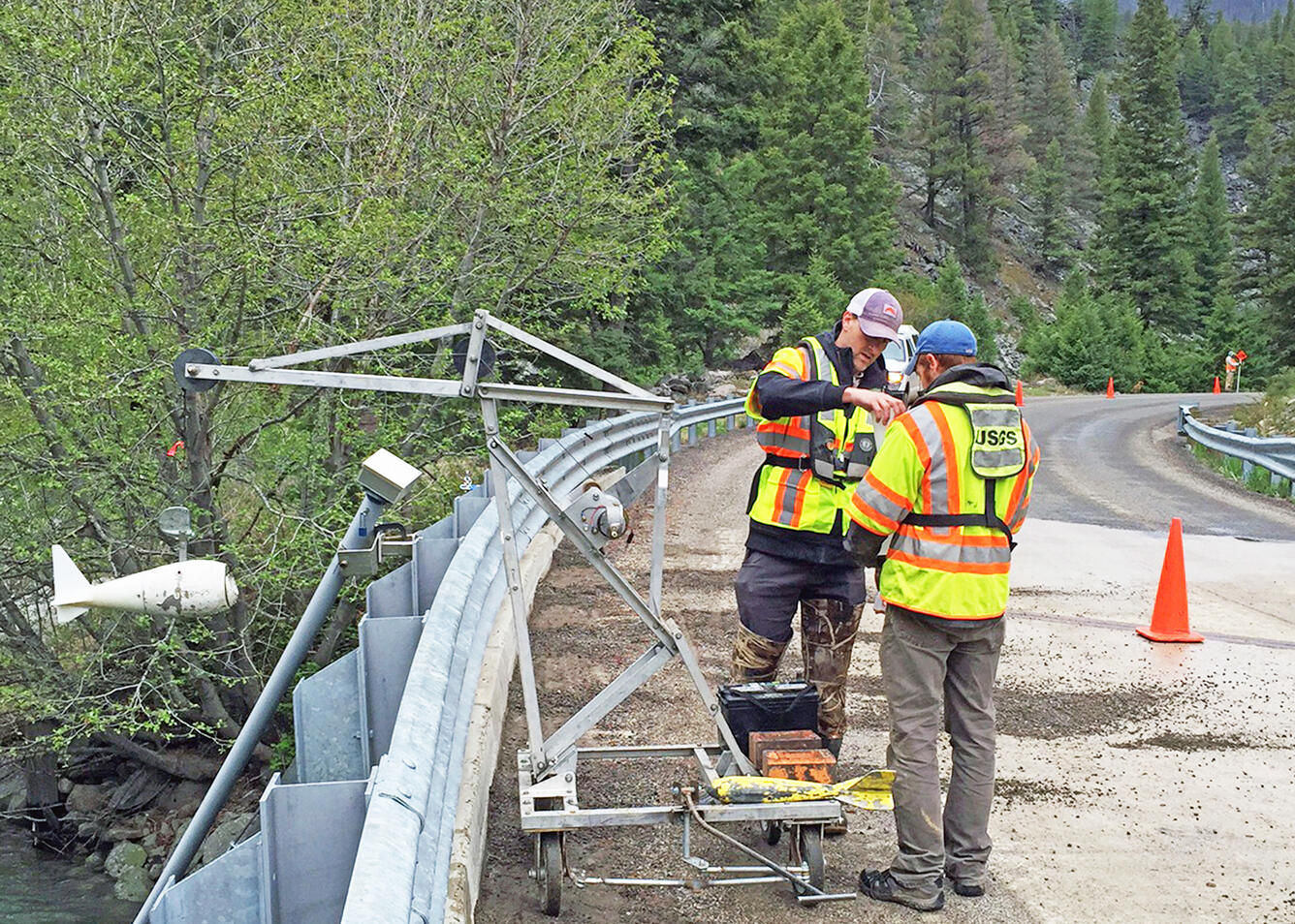 USGS hydrologic technicians collect a sediment sample from the Yankee Fork of the Salmon River