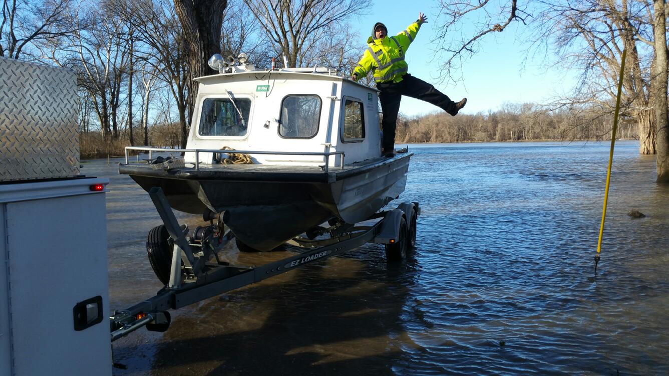 USGS Staff launching a boat in flooded water
