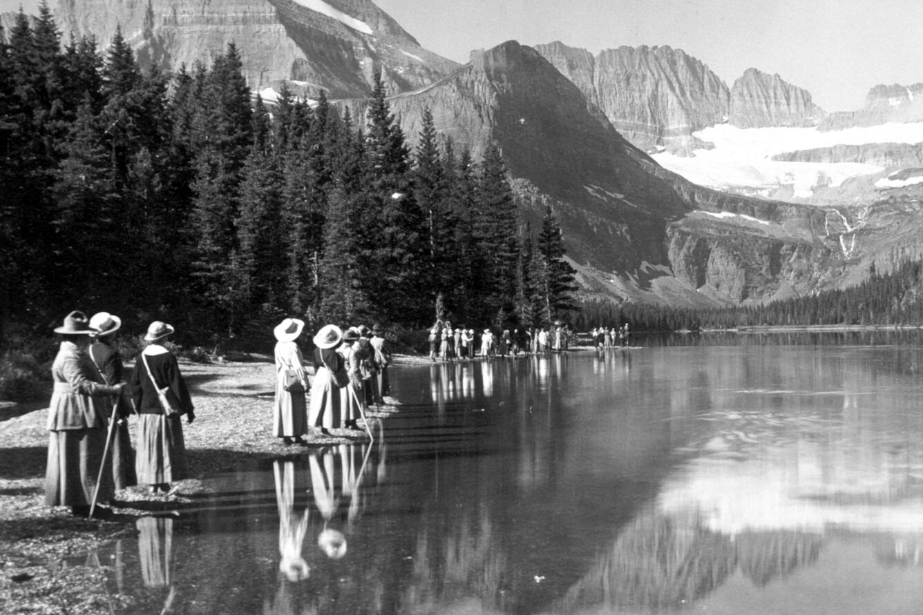 Ladies along the shore of Lake Josephine, Glacier National Park, MT.  Circa 1911