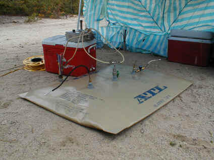 Bladder and pump used for injecting chemical tracers into well sites in the large scale array.