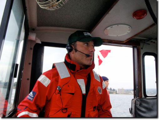 Photograph of Curt Storlazzi piloting a boat for USGS.