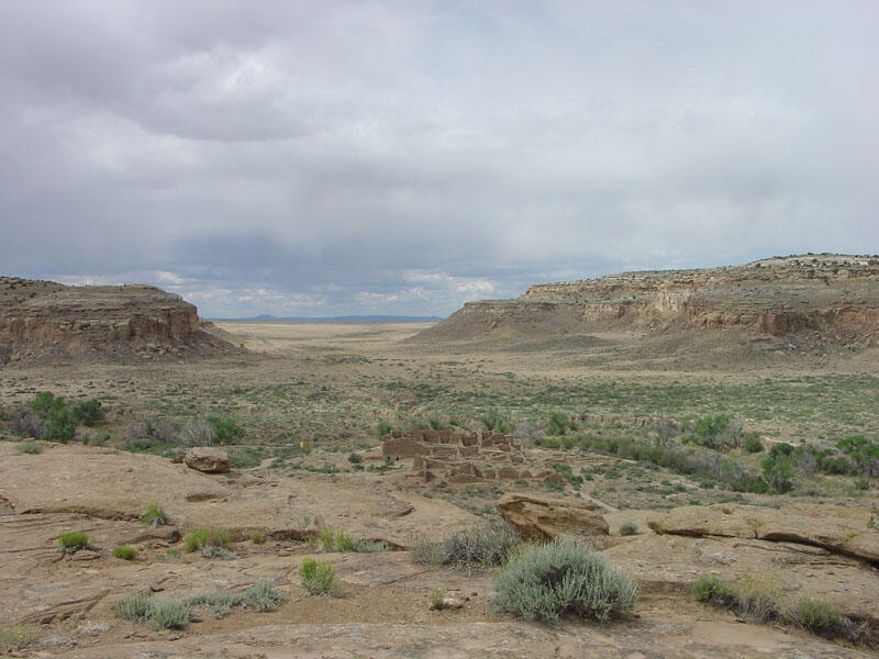 This is a photo of a cliff-top view of Pueblo del Arroyo and South Gap in the distance.