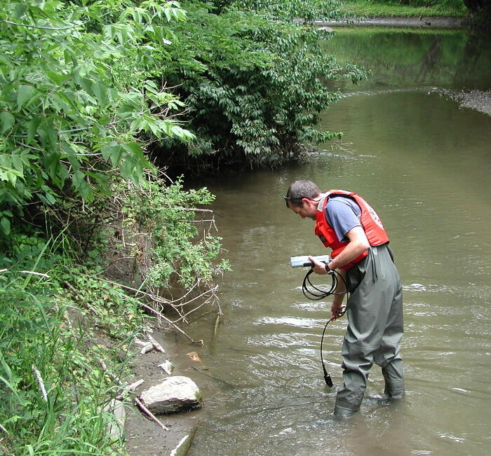 USGS scientist determining if enough dissolved oxygen is present for biodegradation of hormones in Fourmile Creek, Iowa. 