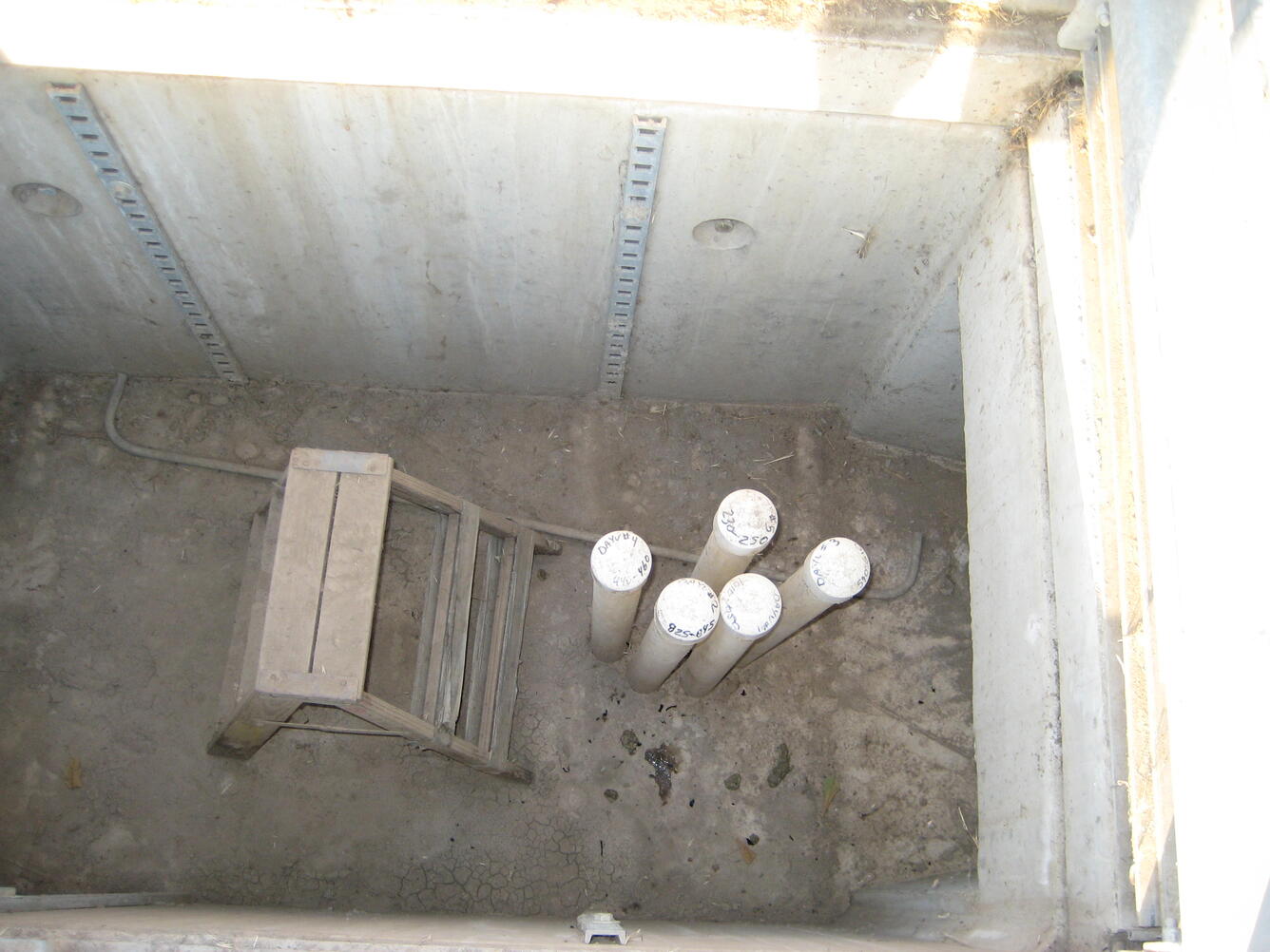 Photo of well site YVDA vault and well casings