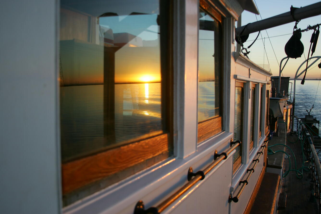 San Francisco Bay sunset reflected in the windows aboard the R/V Polaris.