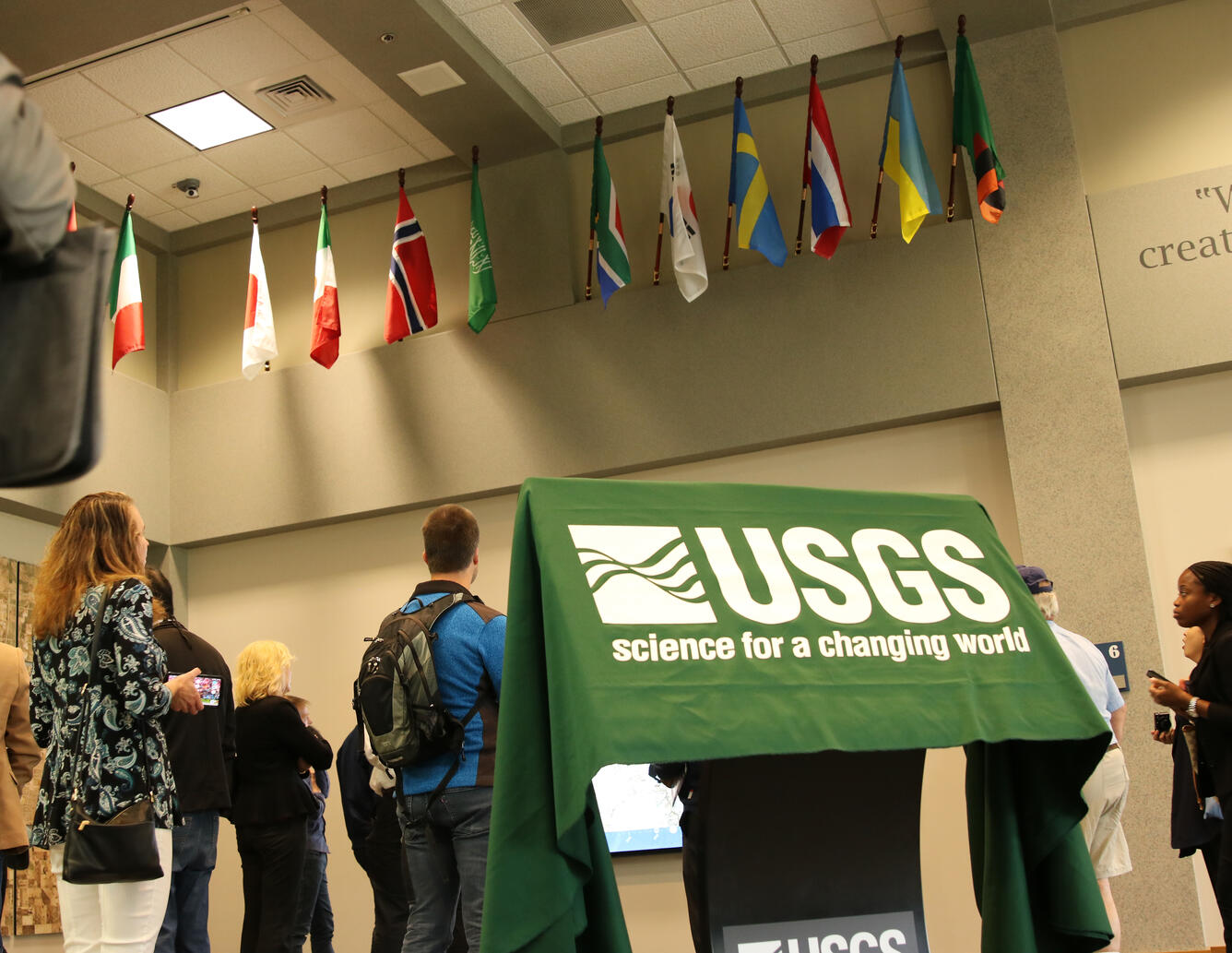 Color photo of USGS banner in lobby of USGS EROS Center