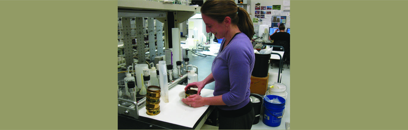Kate Norton at CVO using a sieve to process a sediment sample