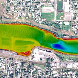 Colorized, multi-beam bathymetry showing scour hole (blue)