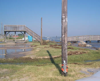 Pressure transducer (sensor) attached to power pole to record storm surge.