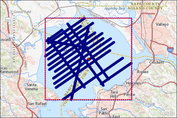 Map shows land and bay with labels, in the water are lines that show ship's path as it collected data.