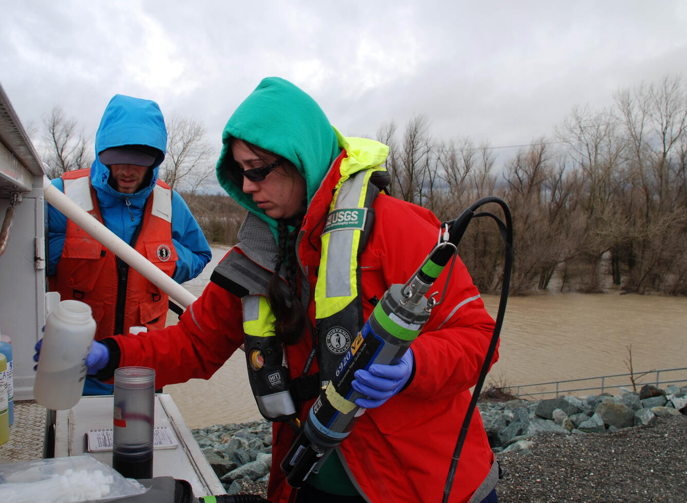 Hydrologist taking samples from Cache Creek