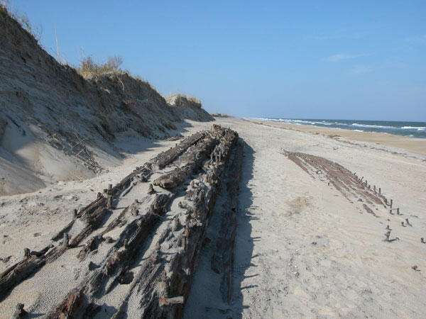 Extensive dune erosion after Hurricane Isabel's 2003 landfall reveals the remains of a ship