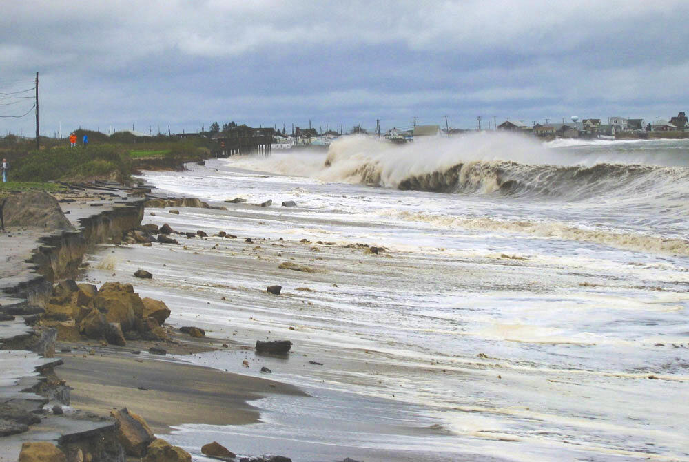 Large waves roll up a rocky beach during a nor'easter in Rhode Island in 2005