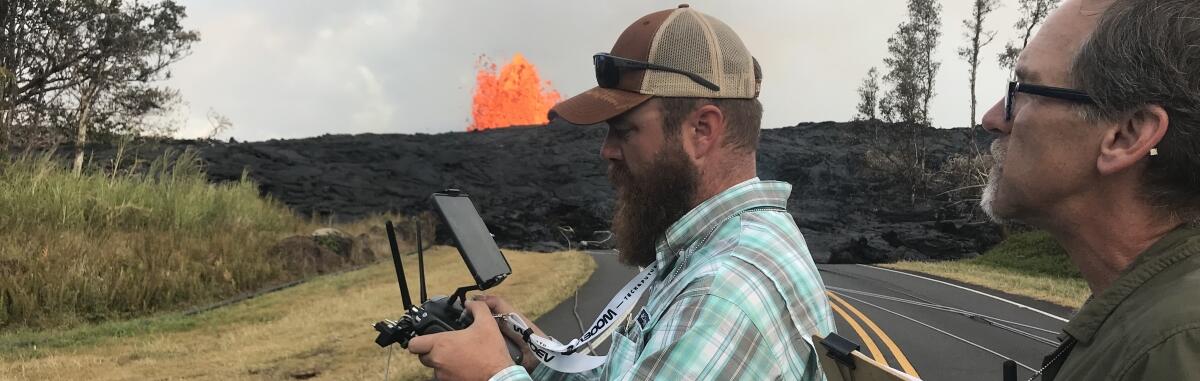 NUSO researchers Todd Burton and Joe Adams performing UAS flight operations at the Kilauea volcano