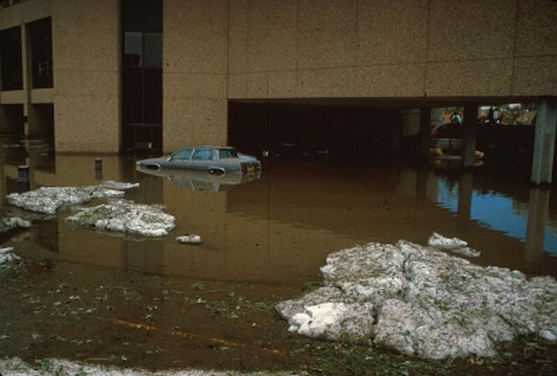 Hail and floodwaters in downtown parking lot