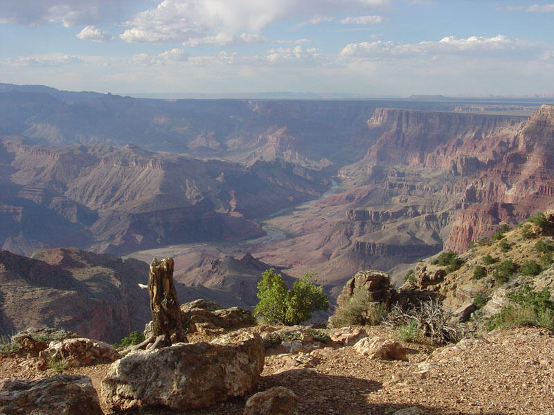 View of Grand Canyon National Park. The Colorado River is visible near the center of the image. 