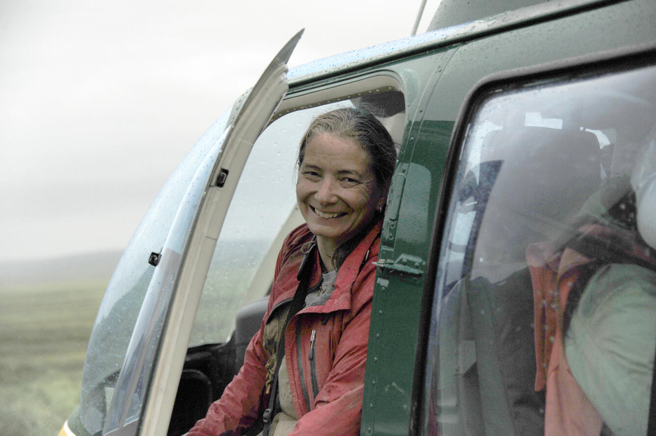 Photo of Kate Whidden in a helicopter