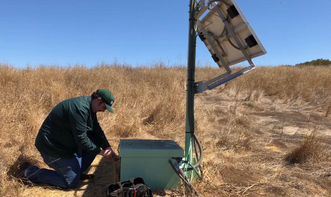 A USGS technician services a ShakeAlert sensor station in the San Francisco Bay area