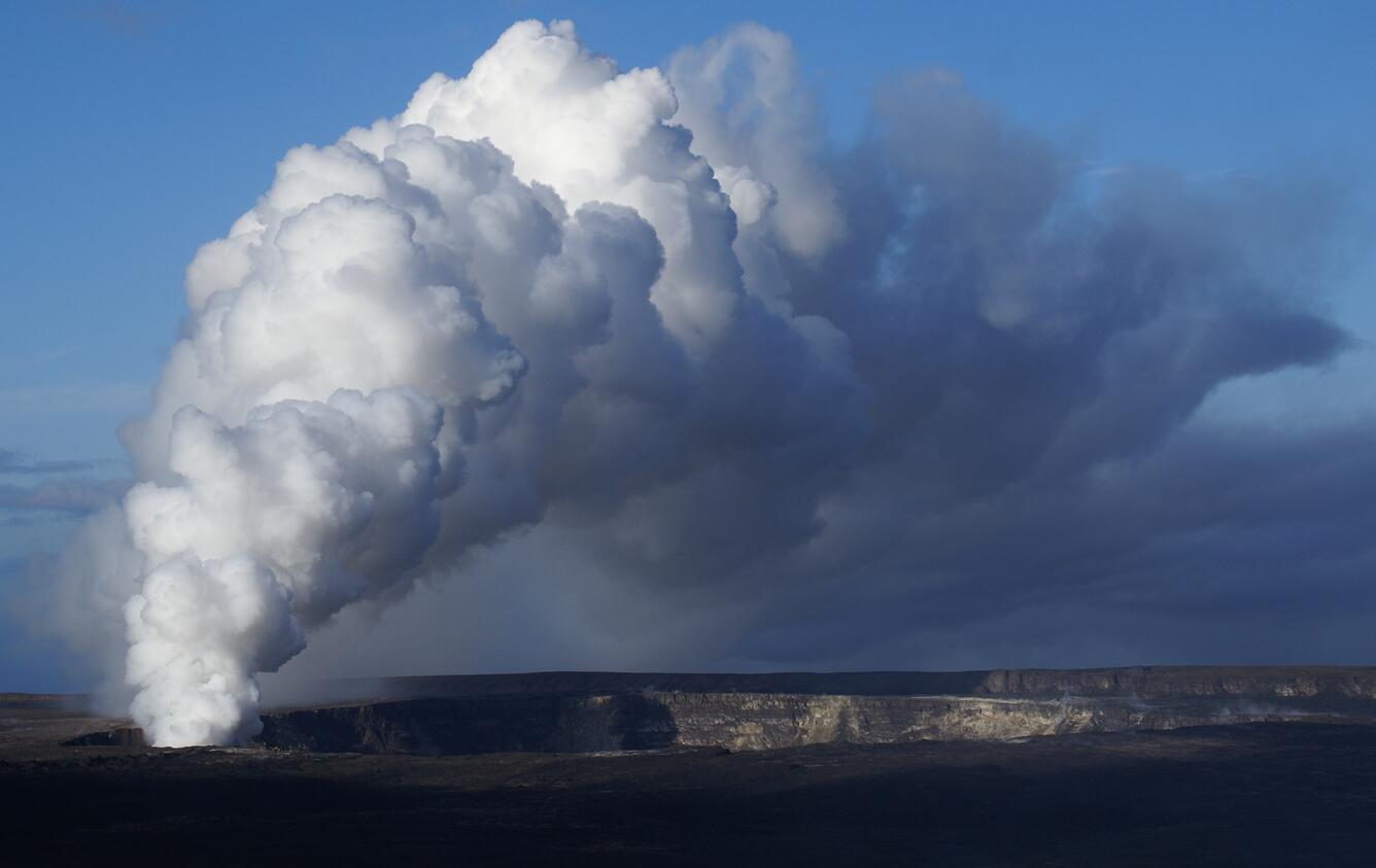 Volcanic-gas plume rises from Halema‘uma‘u Crater, Kīlauea Volcano,...