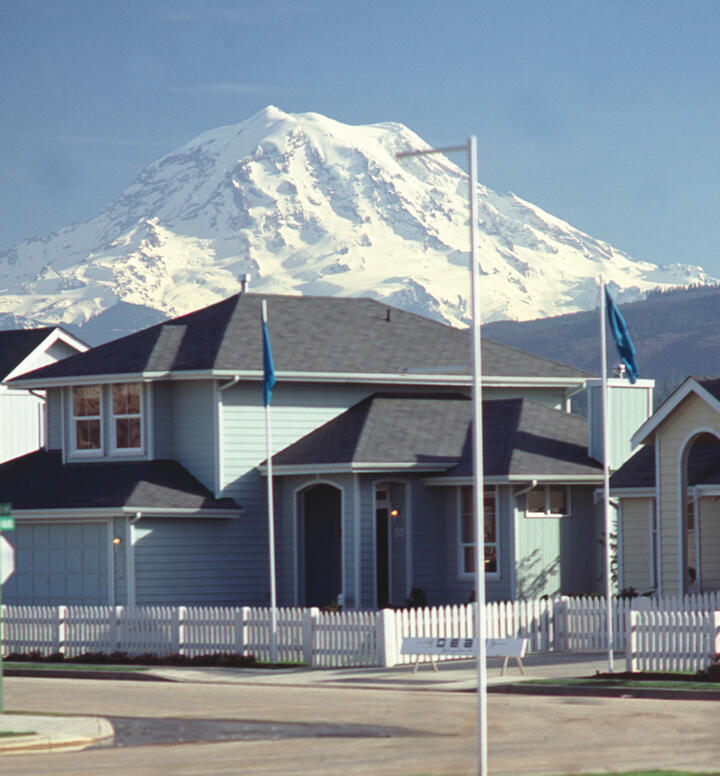 Mount Rainier and houses built in Orting, Washington....