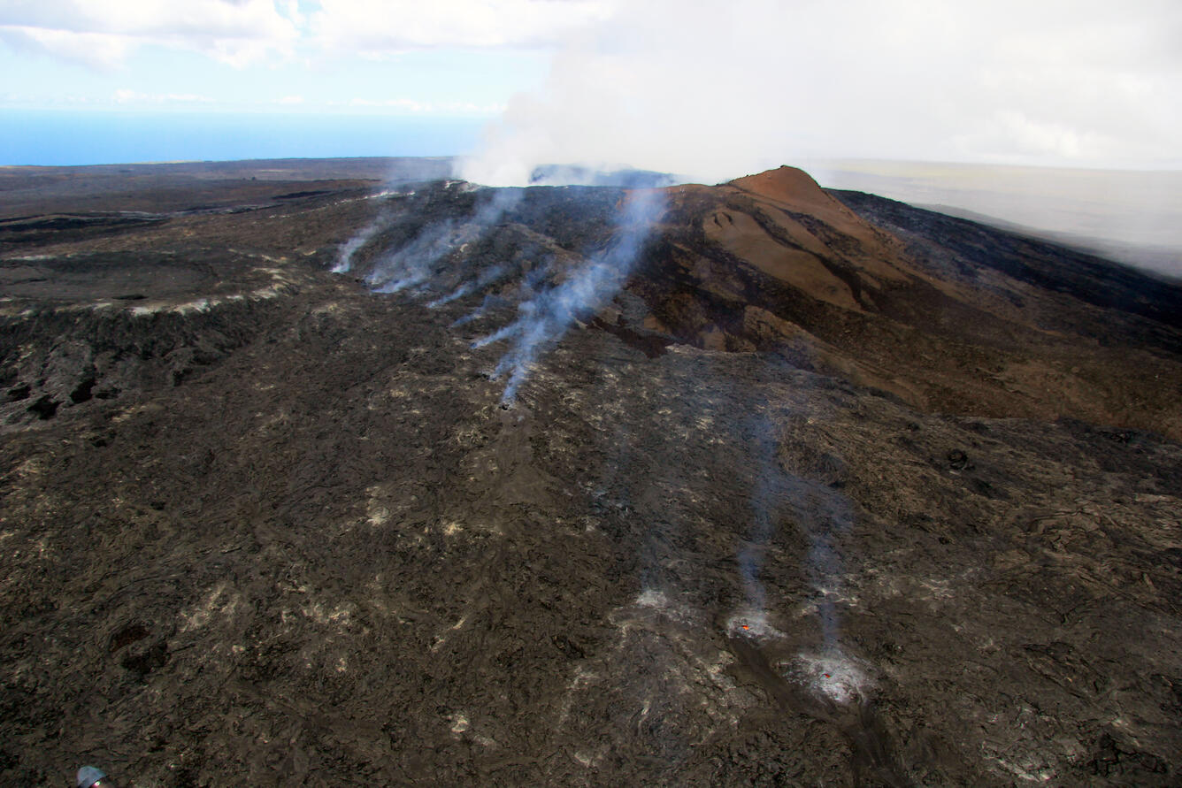 The vent for the June 27th lava flow is on the upper northeast flan...