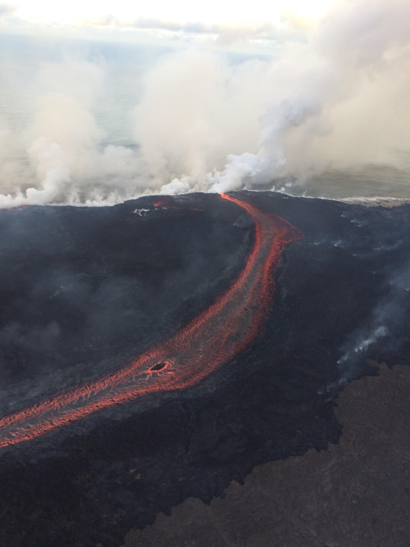 Lava is entering the sea on the southern side of the entry area pri...