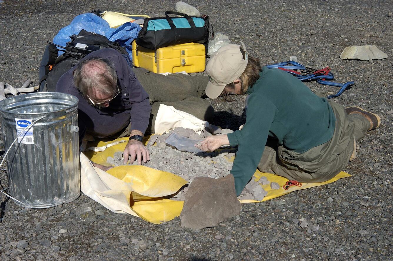 USGS scientists examine new rock samples from the new growth on Mou...